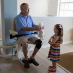 Man on a stirlift after getting home safety upgrades in Howell, MI