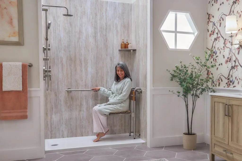 A woman using a doorless shower. Safe bathing options for seniors. 