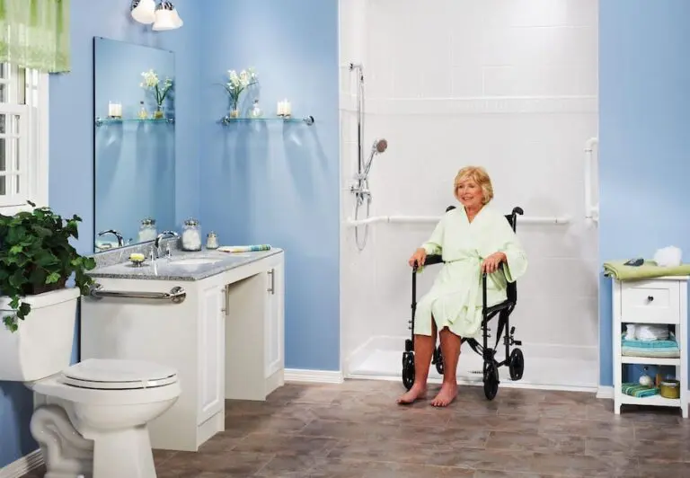 woman using a low-threshold shower. Safe bathroom options for seniors