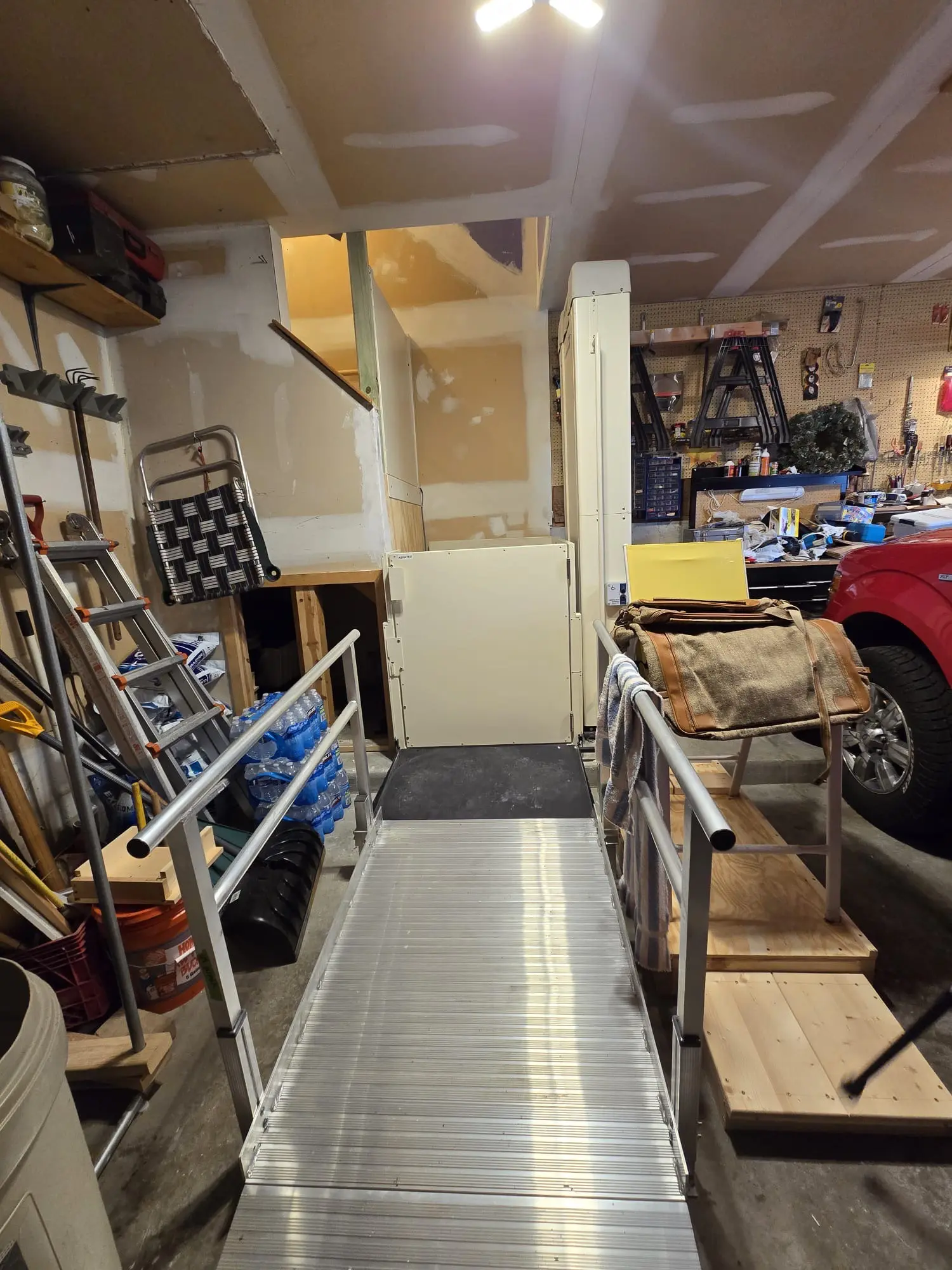 Aluminum Ramp and Vertical Platform Lift In Garage