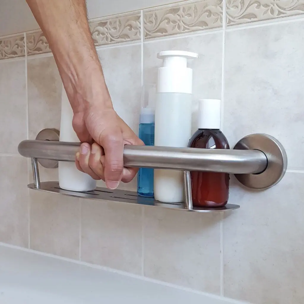 Properly installed shower grab bar securely mounted to a tiled wall